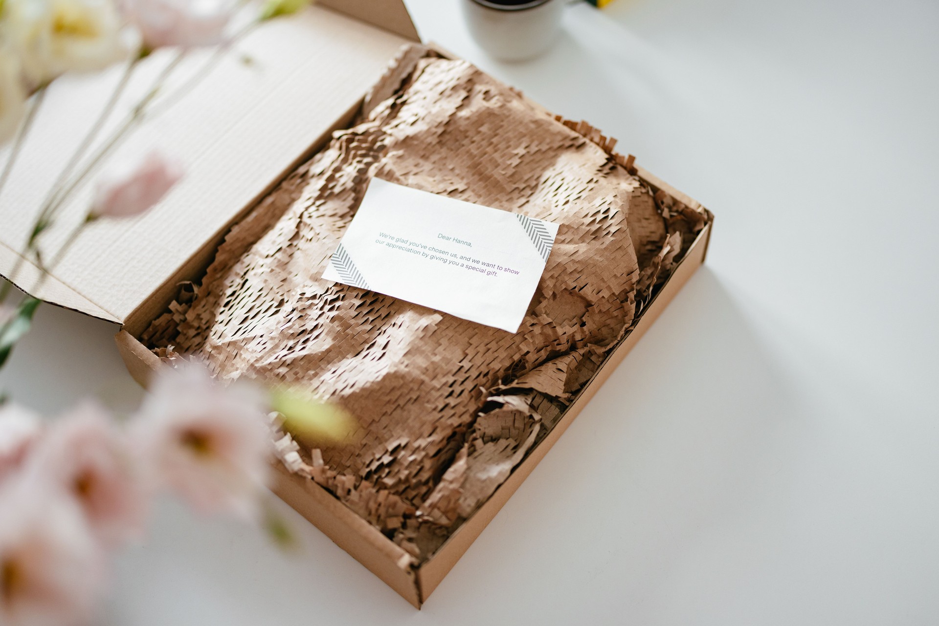 Open Gift Box With a Paper Note