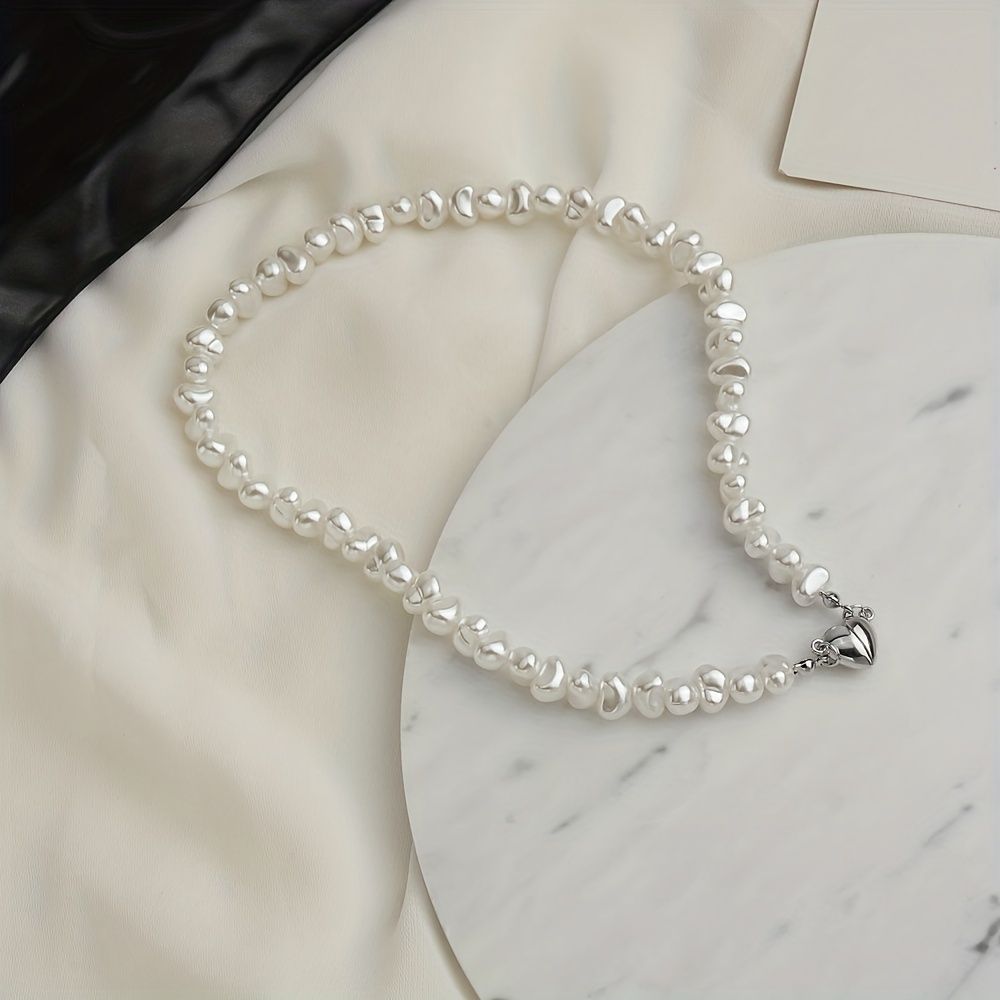 Add a touch of love to your outfit with our Exquisite Irregular Faux Pearl Love Pendant Necklace for Women
