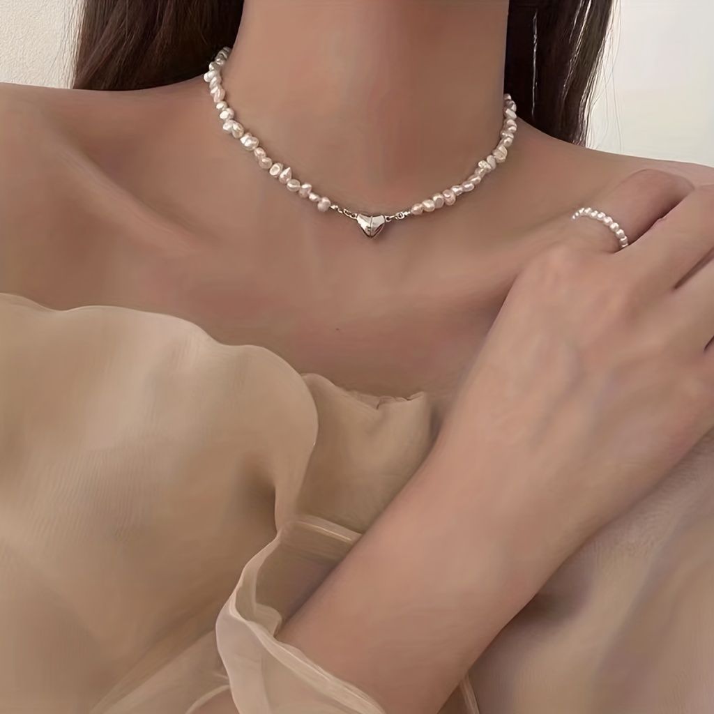Add a touch of love to your outfit with our Exquisite Irregular Faux Pearl Love Pendant Necklace for Women