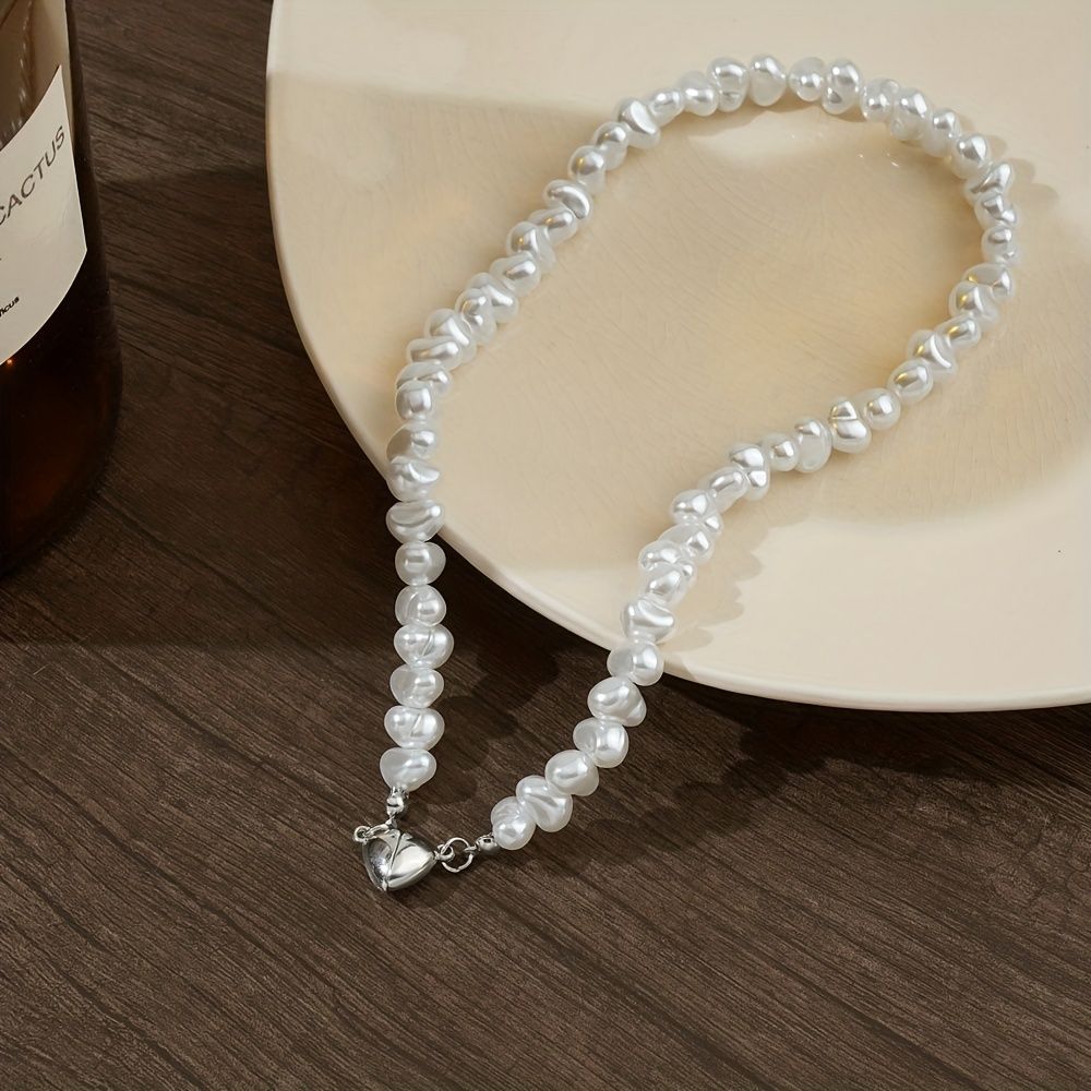 Add a touch of love to your outfit with our Exquisite Irregular Faux Pearl Love Pendant Necklace for Women