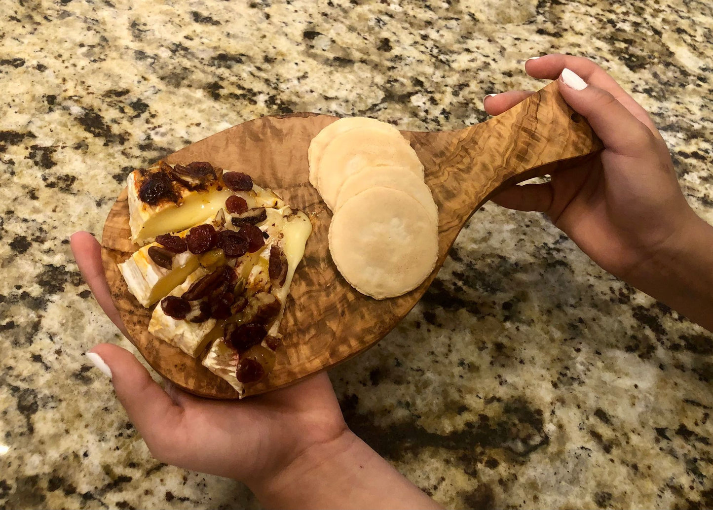 Original Olive Wood Cutting Board with Handle - Handcrafted Mediterranean Wood Charcuterie Board, Cheese Platter & Decorative Serving Tray for Kitchen and Dining, Unique Natural Grain, 11-inch
